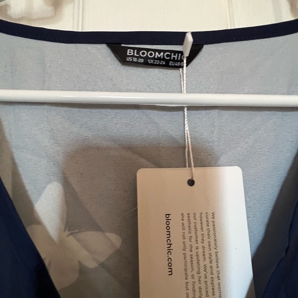 BloomChic ruffled sleeveless navy dress covered in butterflies. Below the knee. - Picture 7 of 7